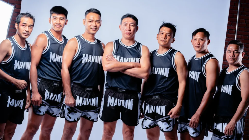 Contact MAVINN coaching team in matching gym kit at the Bangkok camp