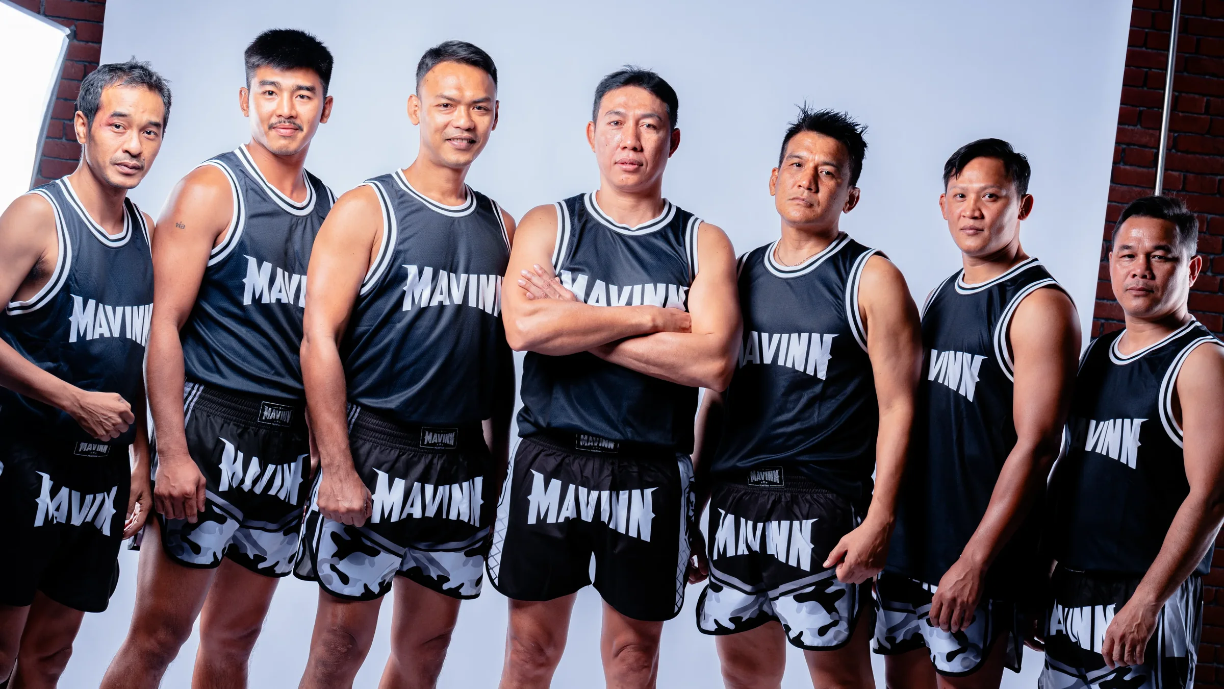 About MAVINN coaching team in matching gym kit at the camp