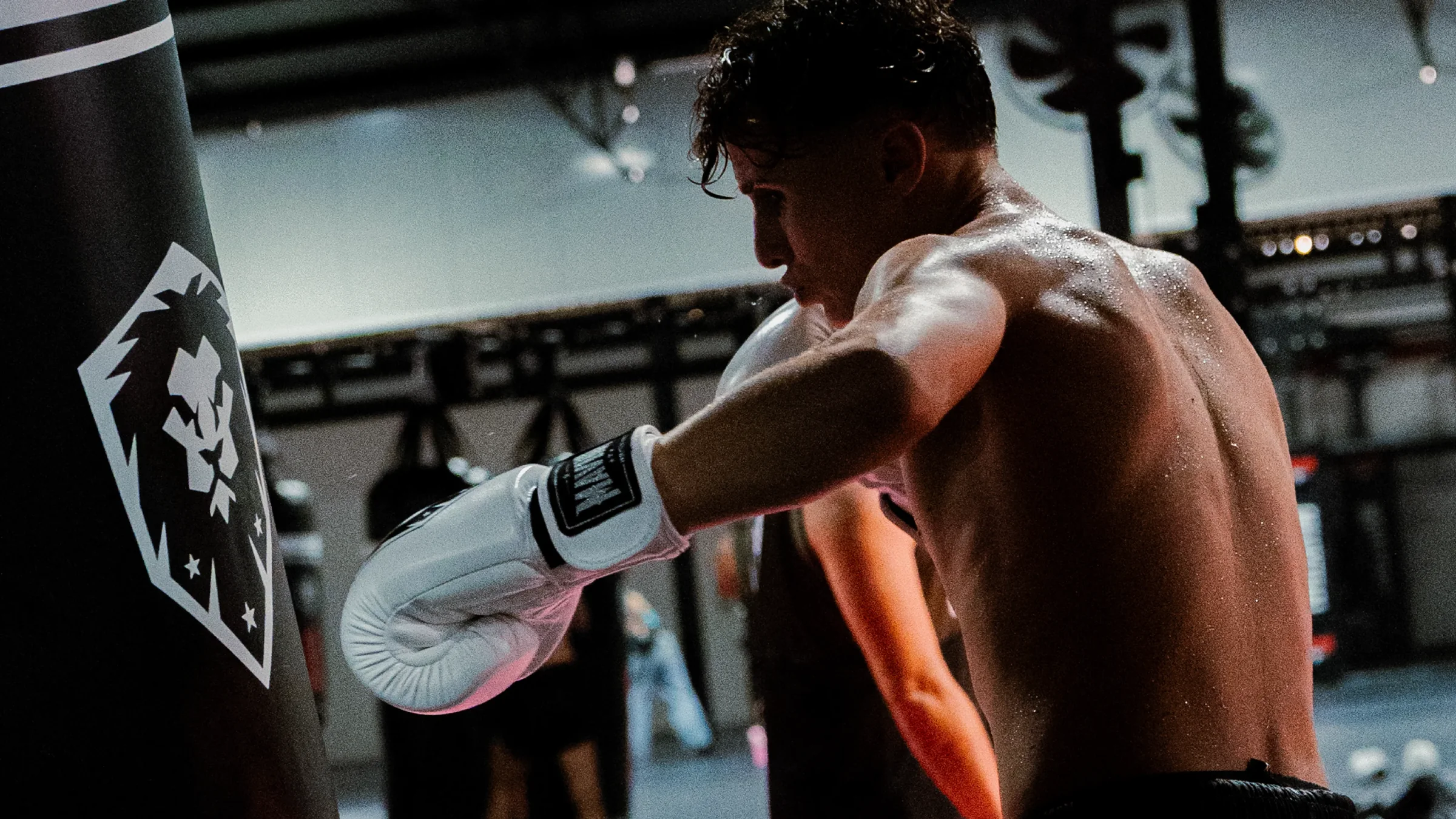 Contact MAVINN fighter kicking a heavy bag during a conditioning round