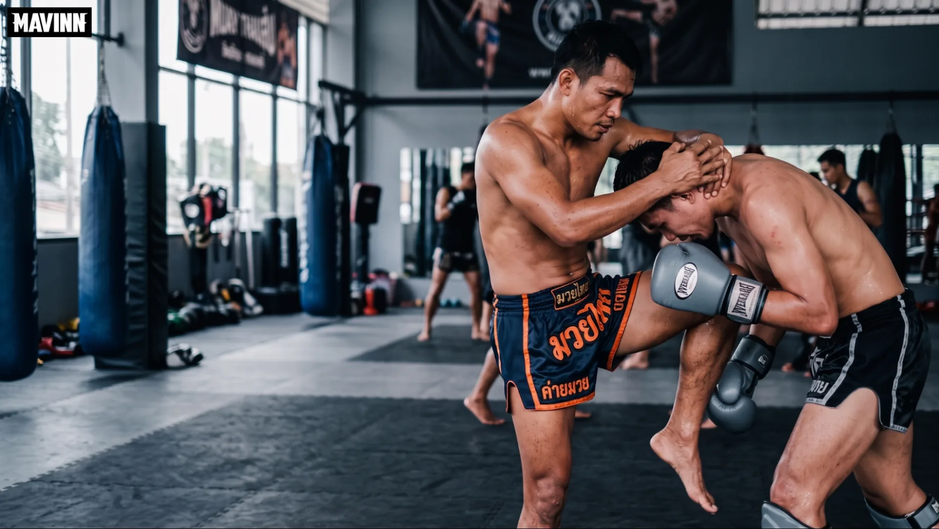 Fighter using a double collar tie to hold his partner in place for a knee