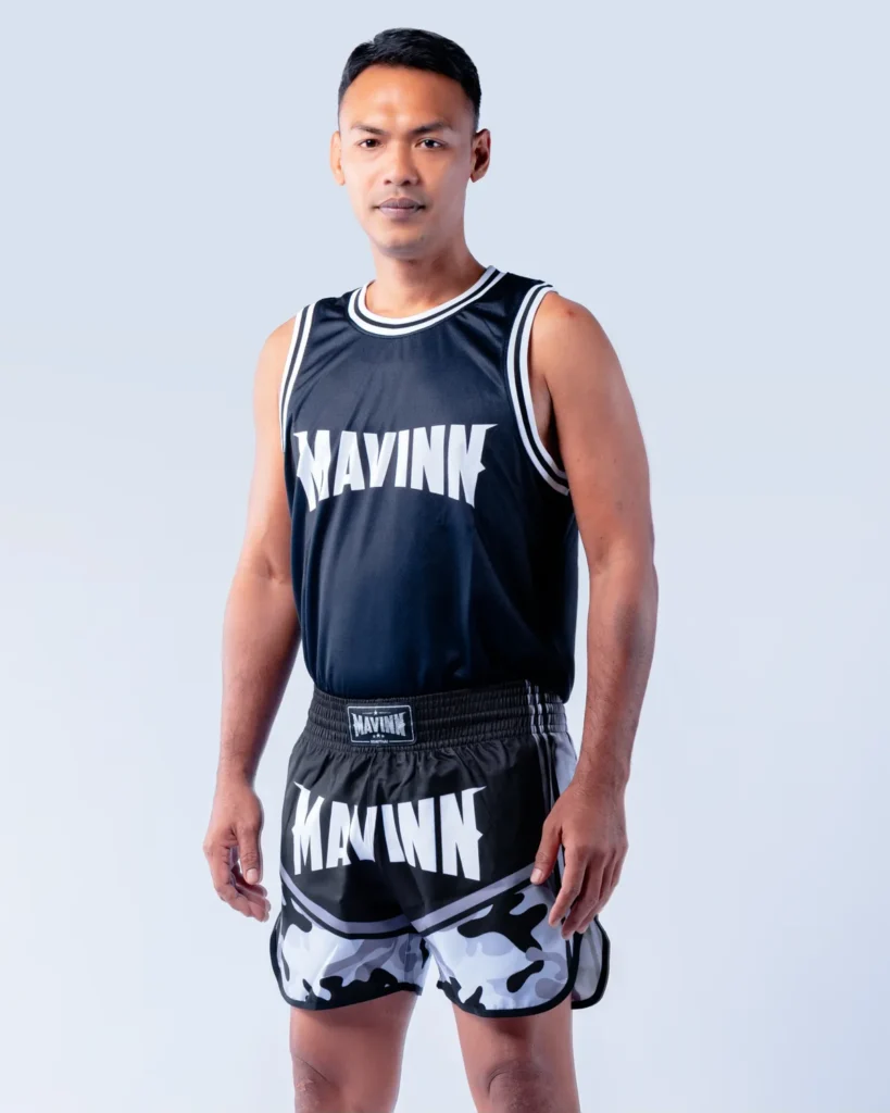 Ahmad Leenainam in MAVINN team vest and camo Muay Thai shorts