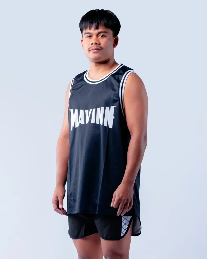 Chalie Singha Mavinn, coach at the MAVINN gym, in team vest and training shorts