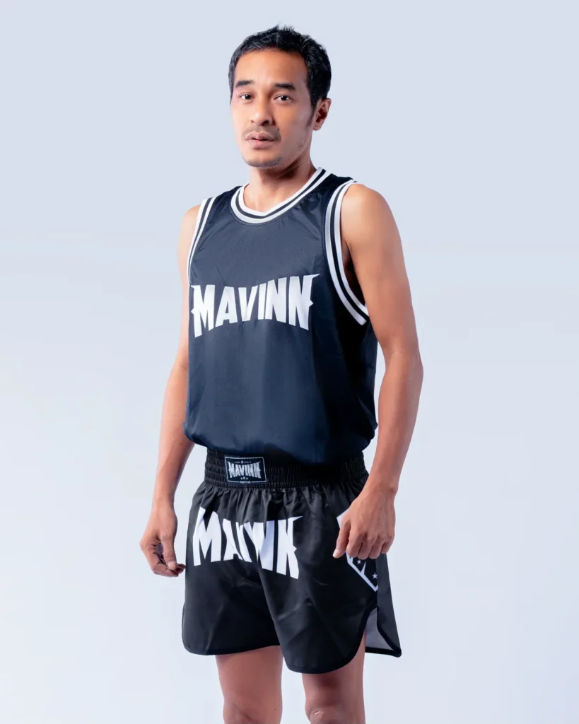 Phobankhem Singha Mavinn in MAVINN team vest and Muay Thai shorts