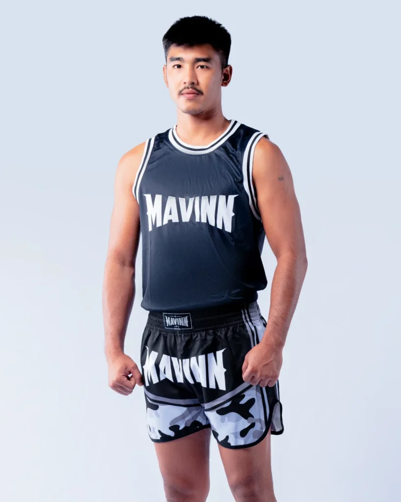 Tapaothong Singmawynn in MAVINN team vest and camo Muay Thai shorts